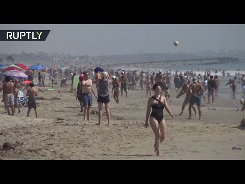 شاهد الشواطئ مكتظة أثناء موجة الحر في كاليفورنيا رغم حظر كورونا